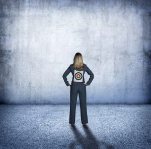 Teacher Standing With A Target On Her Back